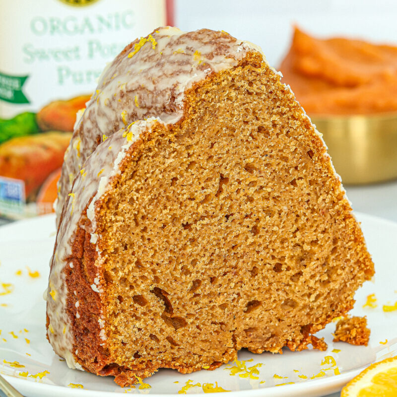 a slice of sweet potato bundt cake with an orange glaze made with Farmer's Market Foods Organic Sweet Potato Puree