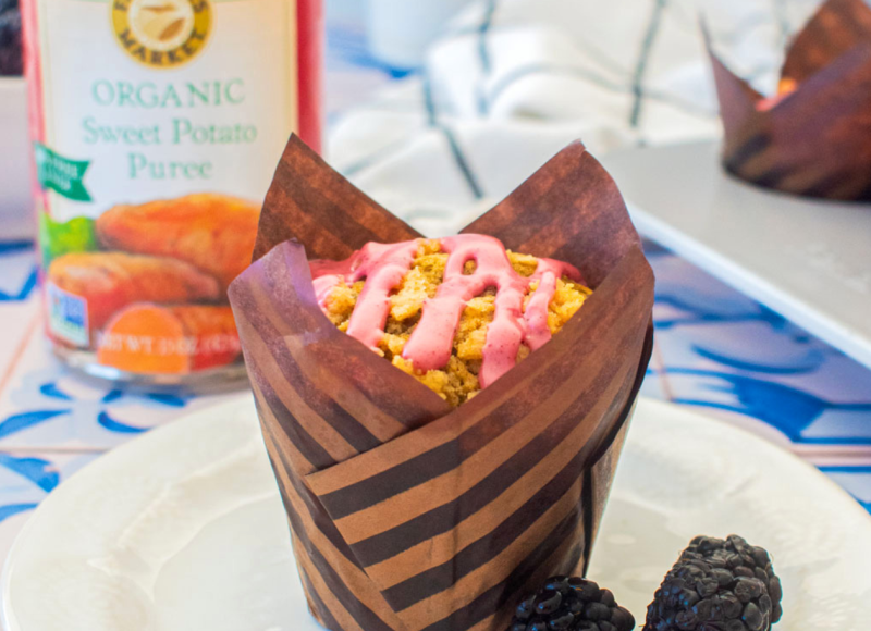 Blackberry sweet potato muffin with a can of Farmer's Market Foods Organic Sweet Potato Puree in the background