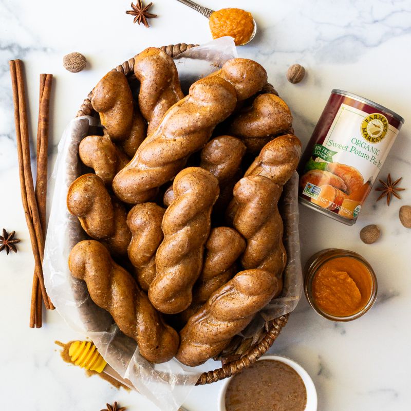 a full platter of gluten-free sweet potato donut twists with a can of Farmer's Market Foods Organic Sweet Potato Pie Mix
