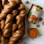 a plate of gf glazed sweet potato donuts with a can of Farmer's Market Sweet Potato Pie Mix