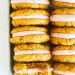 a close up shot of pumpkin cranberry sandwich cookies