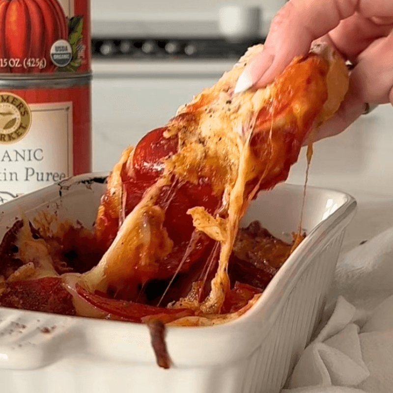 a dish of pumpkin pizza dip with a can of Farmer's Market Foods Organic Pumpkin Puree