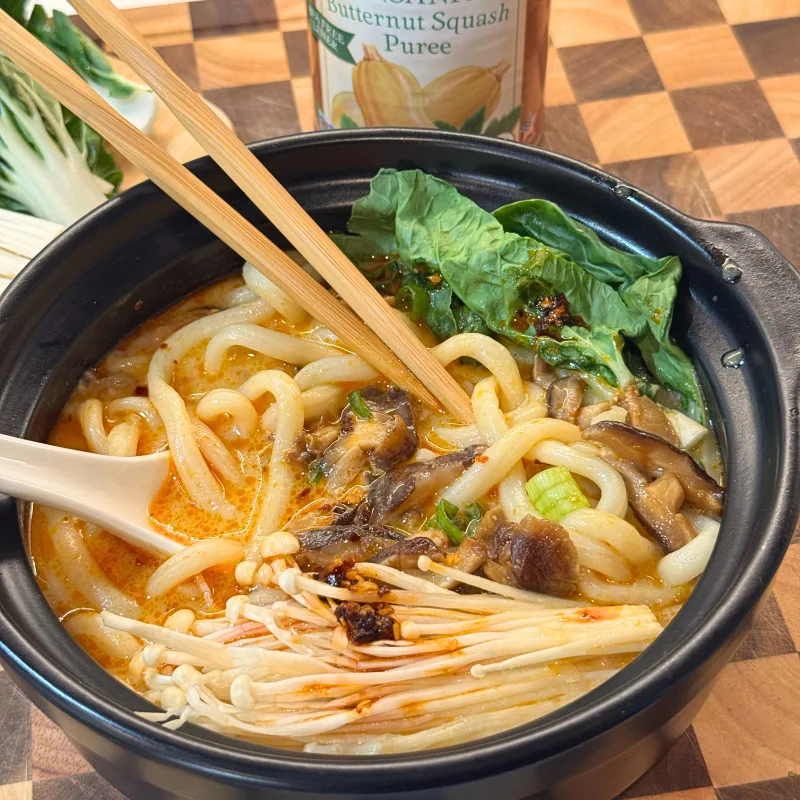 a bowl of butternut squash udon and a can of Farmer's Market Foods Organic Butternut Squash Puree
