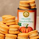 a stack of pumpkin spice macarons next to a can of Farmer's Market Foods Organic Pumpkin Puree