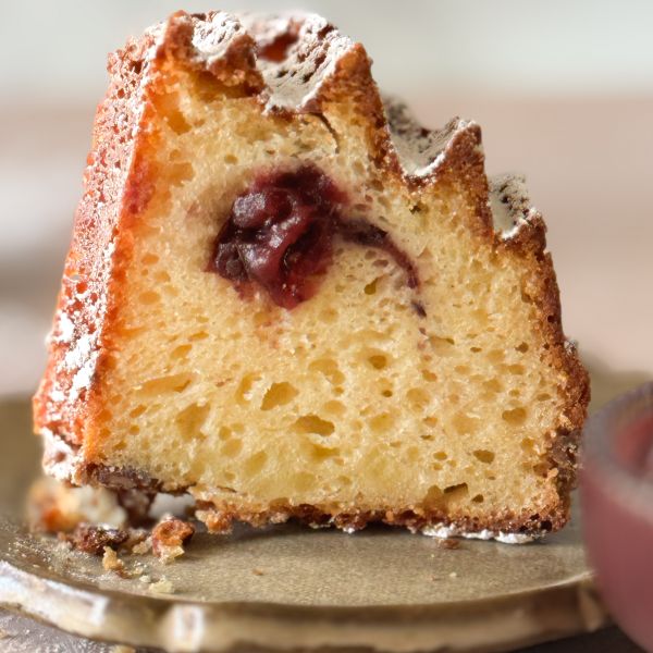 a sliced section of Cranberry Pecan Coffee Cake